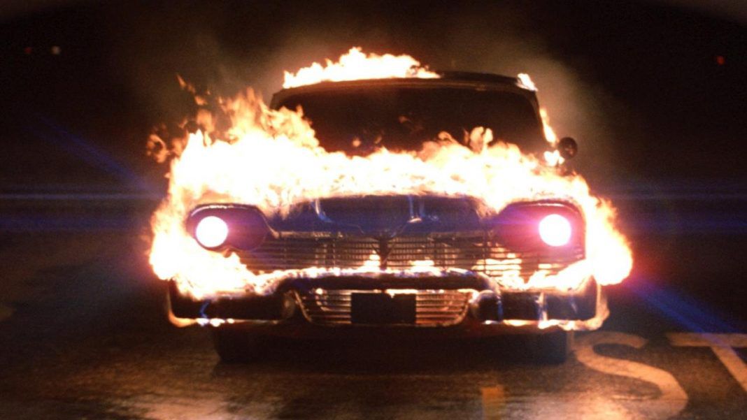 A car engulfed in flames in Christine.