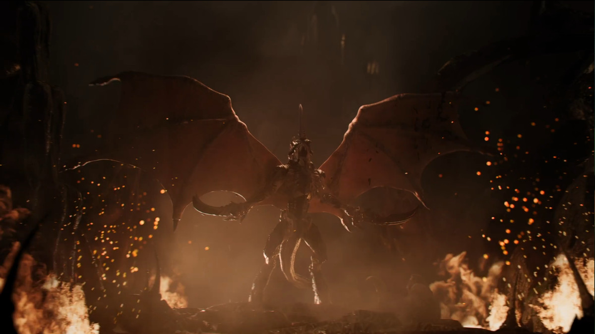 A Tyranid roars, extending its wings and alien limbs in a trailer for Warhammer 40,000’s 10th edition. The tyranid is a fearsome beast, surrounded by fire and ash.
