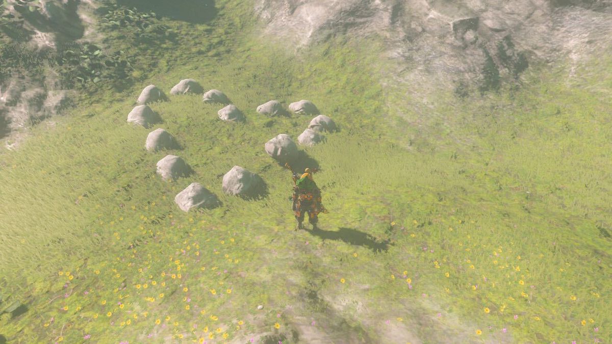 En bild av Link i The Legend of Zelda: Breath of the Wild.  Han står framför en rad stenar formade som ett hjärta.