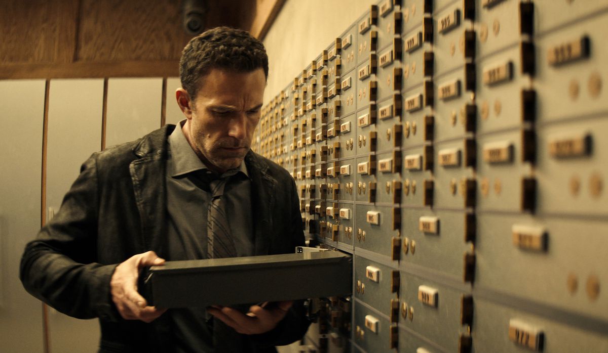 Ben Affleck stares intensely at a safety deposit box next to a row of them in Hypnotic.
