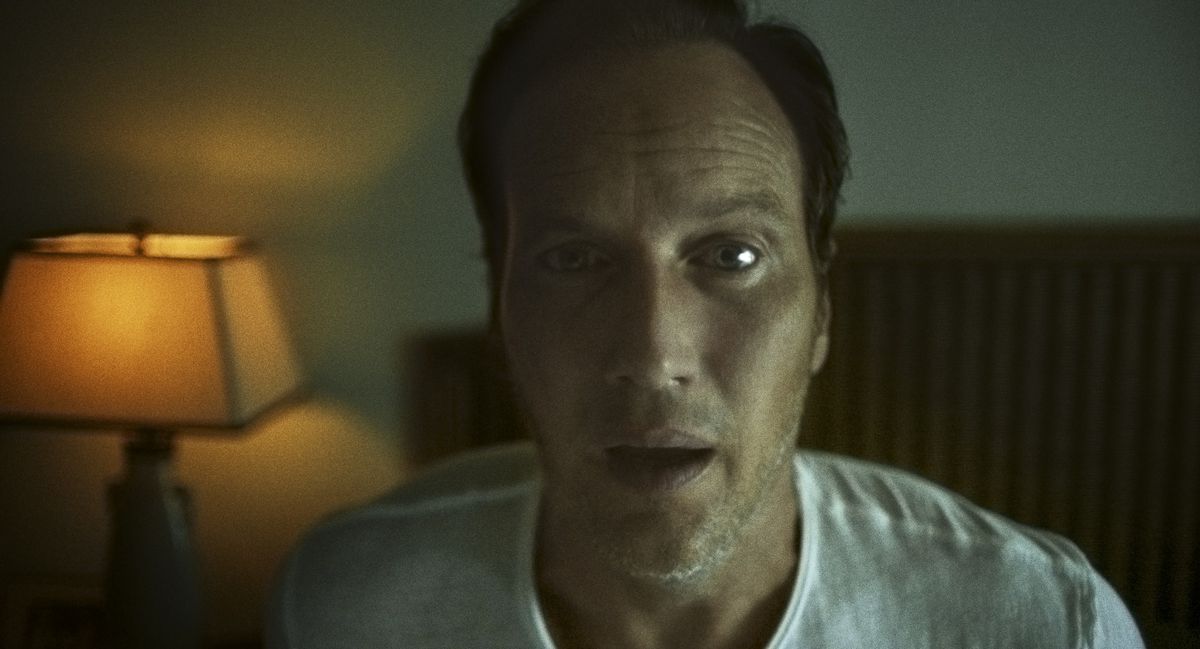 Patrick WIlson sits up in bed, startled, in Insidious: Fear the Dark.