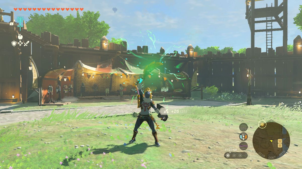 Link, in the Sheikah armor, lifts up a sword merged with a Black Lizalfos horn attached to it, freshly Fused with a green glow in Tears of the Kingdom