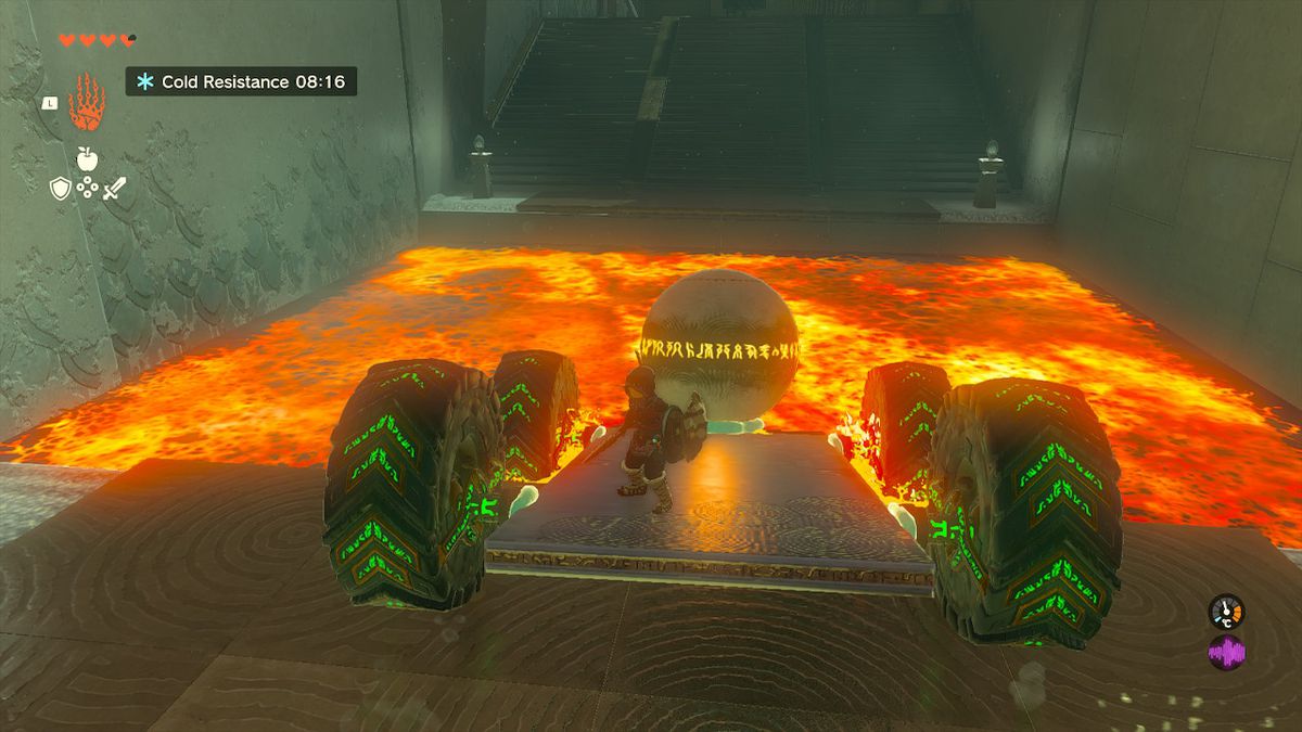 Link åker en vagn med en klot på över en lavapool i Tukarok Shrine i Zelda Tears of the Kingdom.