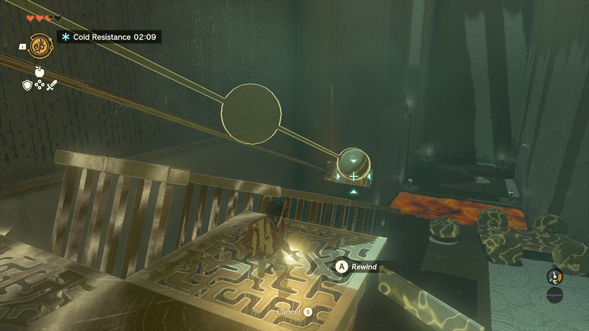 Link låter en klot glida nedför en räls i Tukarok Shrine i Zelda Tears of the Kingdom.