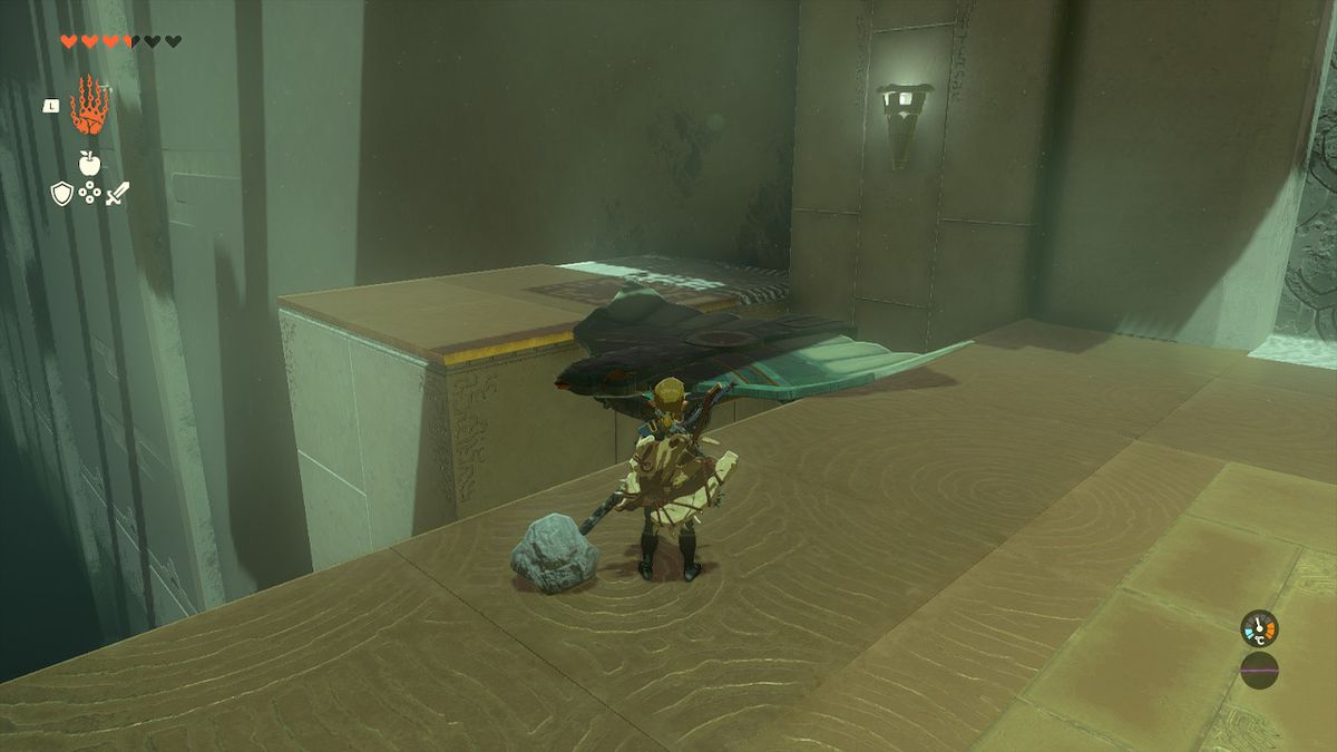 Link placerar en vinge mellan två avsatser för att göra en bro i Jirutagumac Shrine i Zelda Tears of the Kingdom.