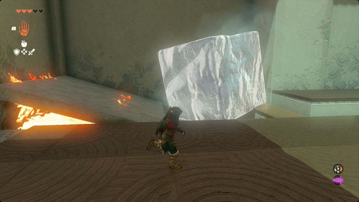 The Legend of Zelda: Tears of the Kingdom Link med hjälp av en stenpanel för att blockera lågor i Kiuyoyou Shrine.
