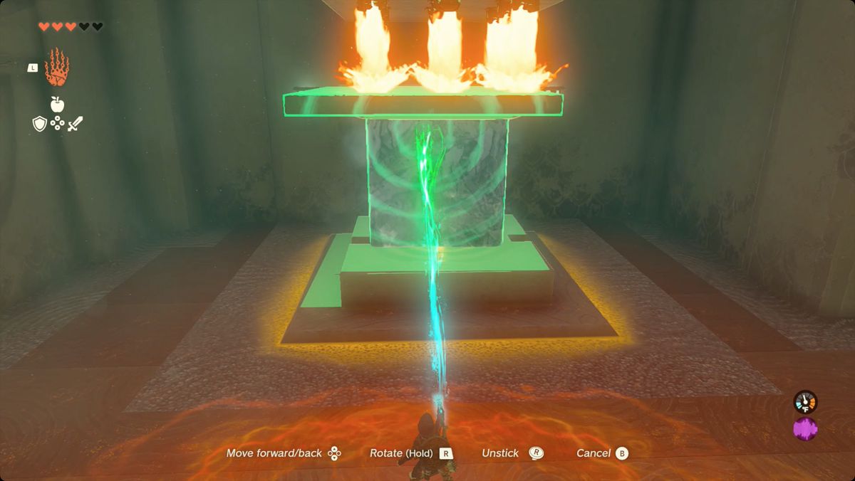 The Legend of Zelda: Tears of the Kingdom Link placerar ett isblock med en stenpanel fäst på toppen på en knapp i Kiuyoyou Shrine.
