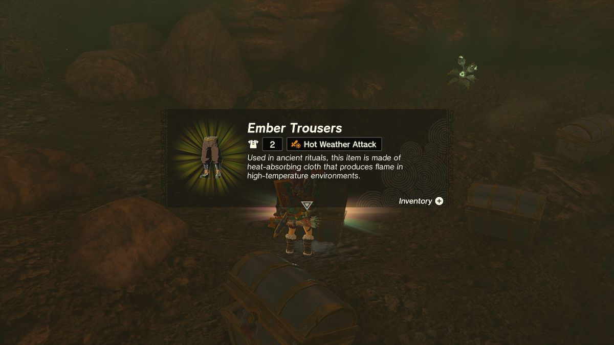 Link plockar upp Ember Trousers från insidan av bröstet i Zelda: Tears of the Kingdom