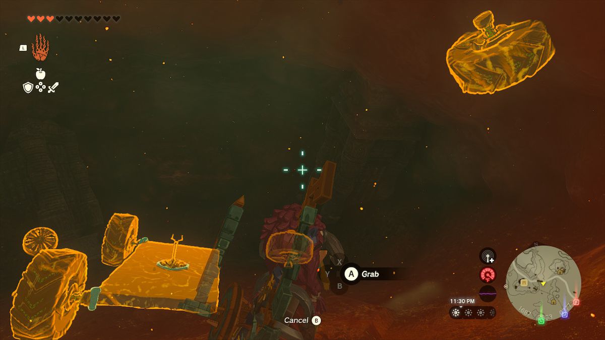 Link använder Ultrahand för att ta tag i hjulen och slutföra Zonai-konstruktionen i Zelda: Tears of the Kingdom