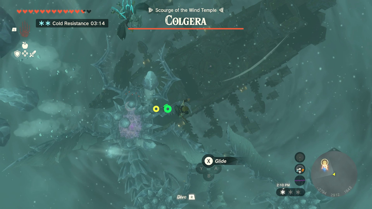 Link svävar ovanför jättemonstret Colgera på sitt glidflygplan i Zelda: Tears of the Kingdom.  Dess rygg är täckt med åsar av spikar gjorda av is.  Dess namn sitter ovanför en fullständig hälsobar högst upp på skärmen.