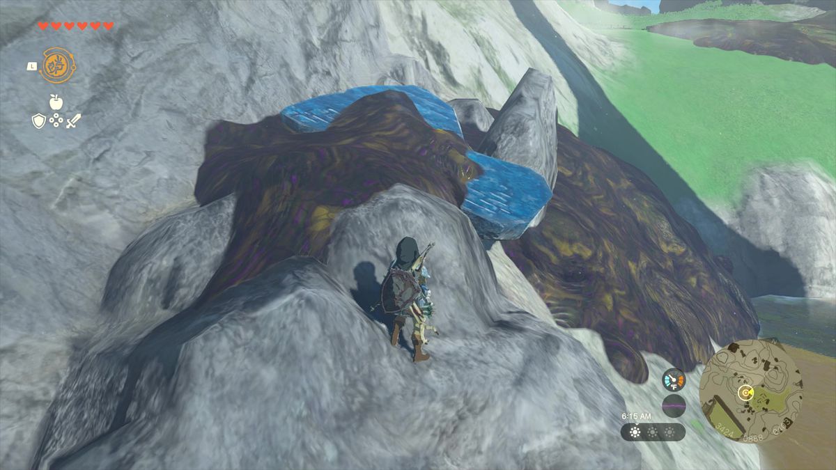 The Legend of Zelda: Tears of the Kingdom Link står bredvid lera som täcker Jiahtos skiffer.