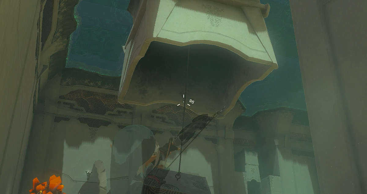 Länk som riktar en pil mot ett rep som hänger från taket i Zelda: Tears of the Kingdom.