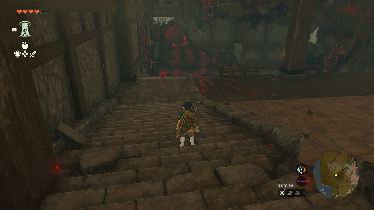 Link stirrar på en dyster pöl i Hyrule Castle i Zelda Tears of the Kingdom.