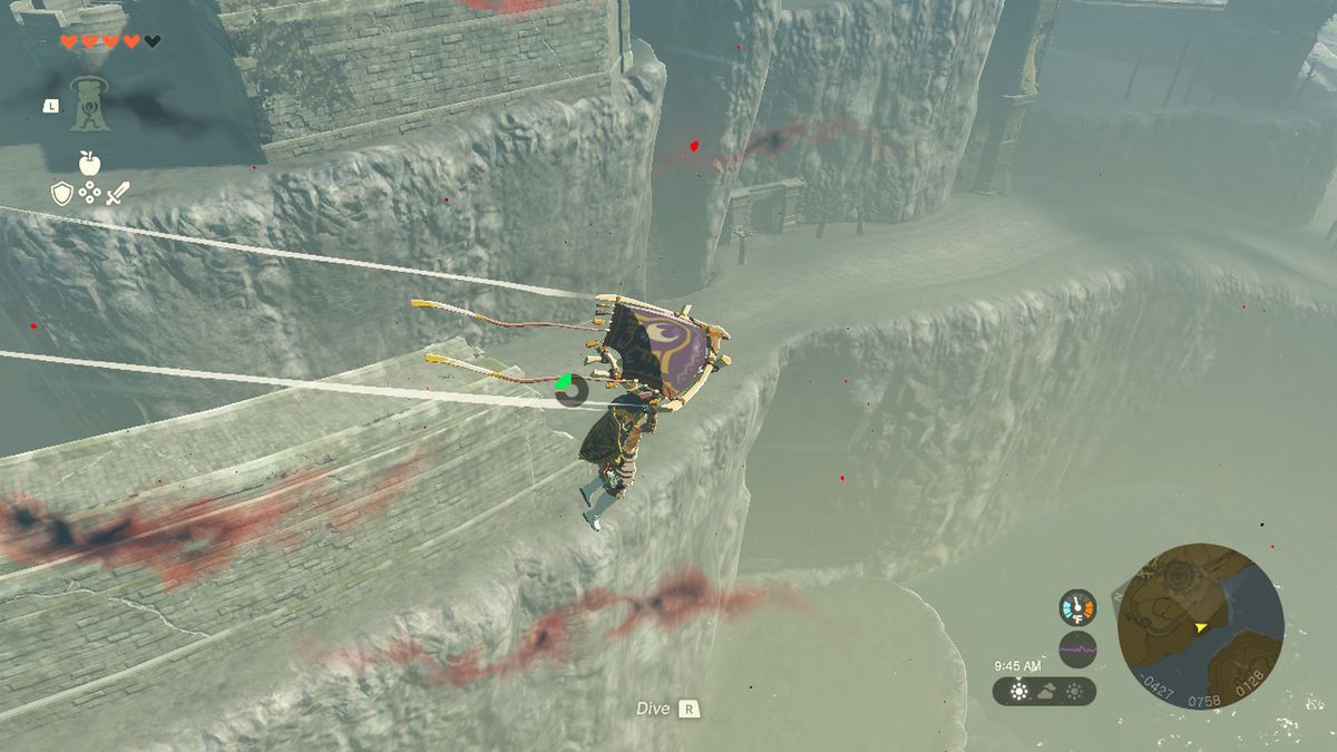 Link glider förbi en klippa nära Hyrule Castle i Zelda Tears of the Kingdom.