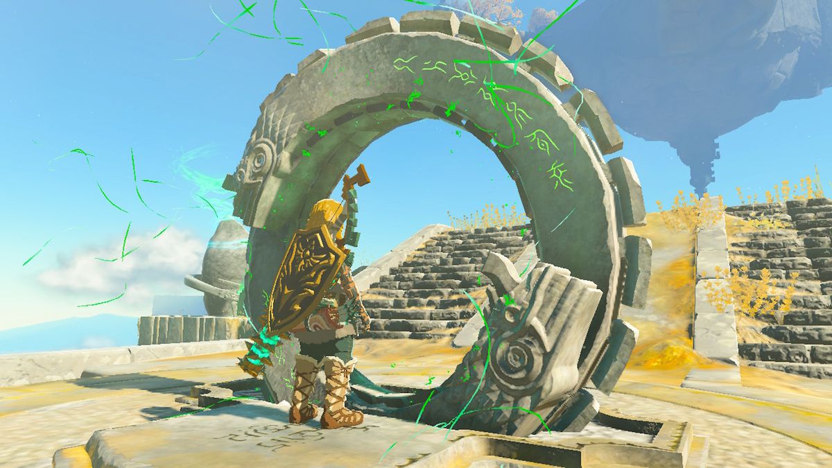Link stands next to a giant ring on a sky island in Zelda Tears of the Kingdom.