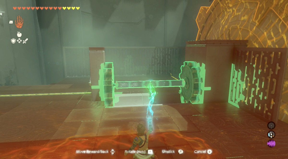 En bild visar Link som tar bort en pelare mellan två kuggar i The Legend of Zelda: Tears of the Kingdom.