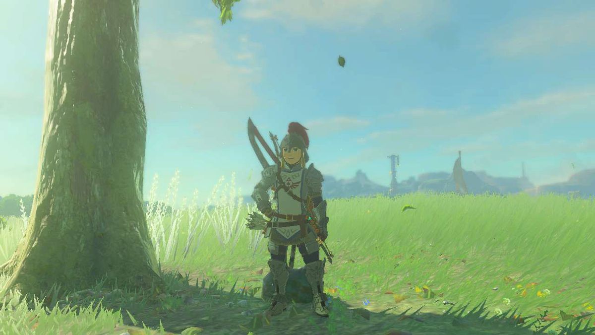 Link wears the Soldier’s Armor while standing near a tree on a sunny day.