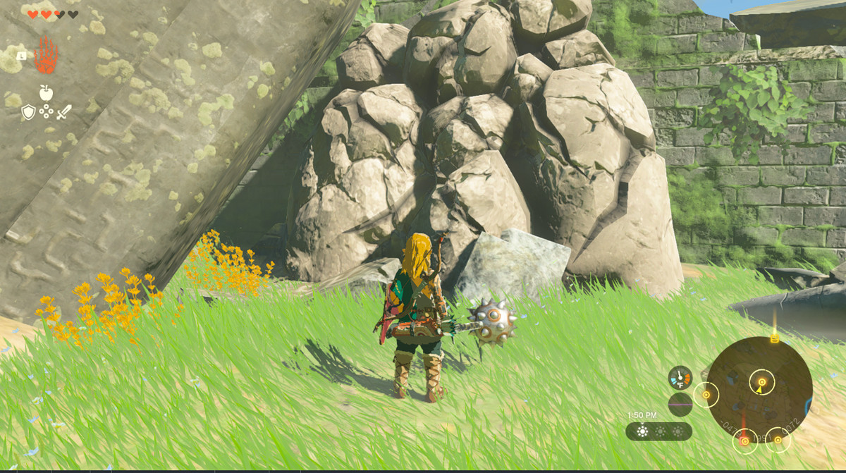 Link krossar ett stenblock som blockerar en väg i Zelda Tears of the Kingdom.