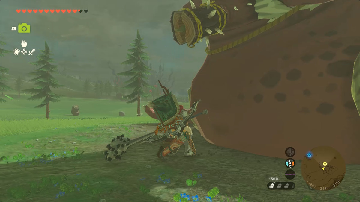 Link smyger upp på en sovande Hinox på en åker i Zelda Tears of the Kingdom.