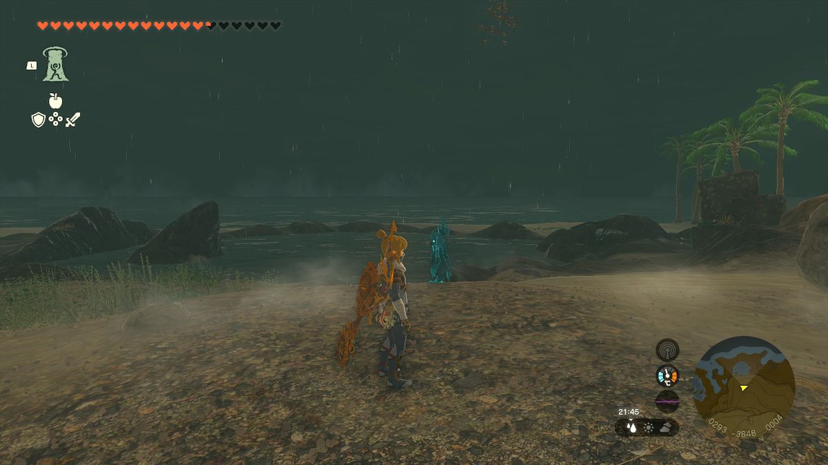 Link står på en strand på natten och letar efter Phantom Armor i Zelda Tears of the Kingdom.