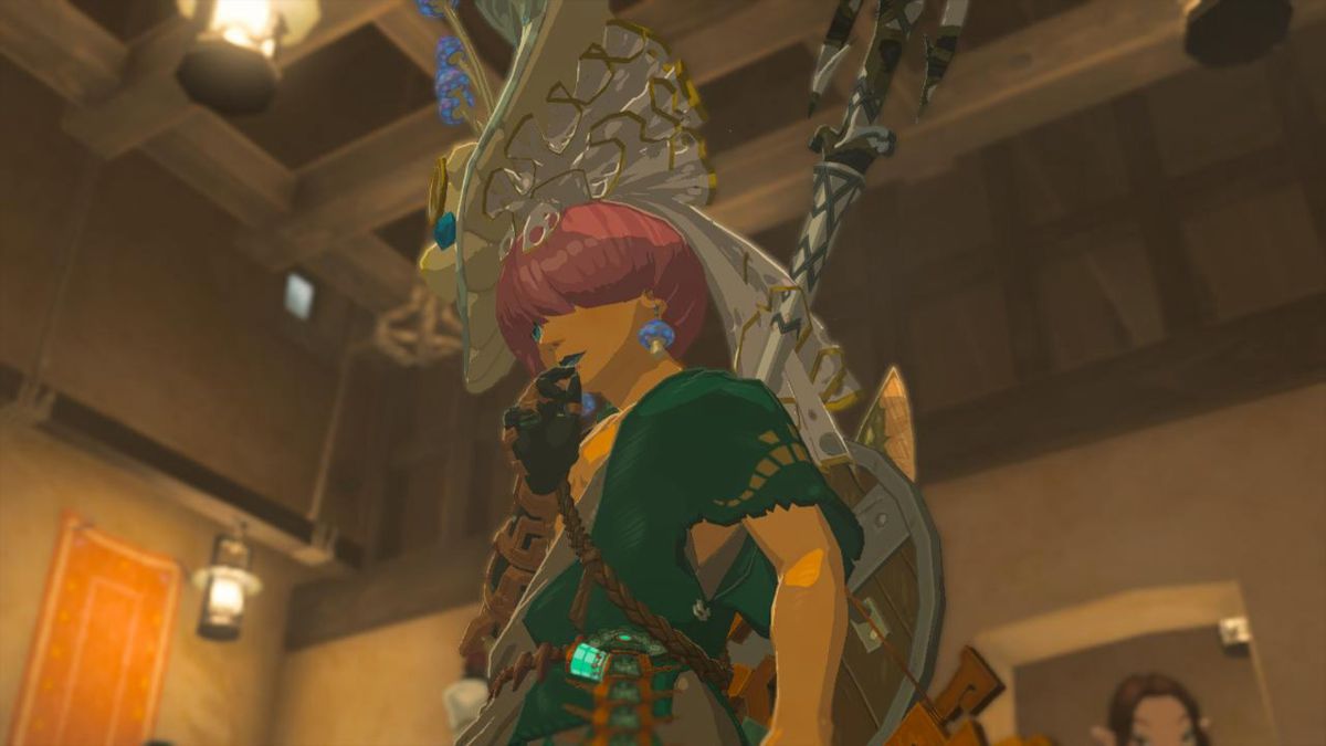 Dramatisk pose av Link som bär Ceces hatt i Tears of the Kingdom