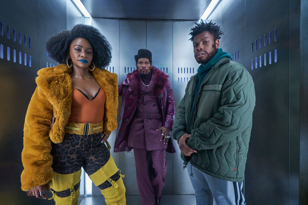 Teyonah Parris, Jamie Foxx, and John Boyega stand in an elevator and look fly as hell in THey Cloned Tyrone.
