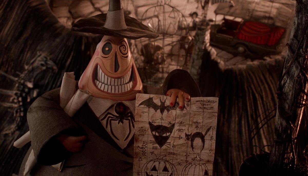 Borgmästaren i Halloween Town ler medan han håller planerna för nästa års Halloween-firande i The Nightmare Before Christmas.