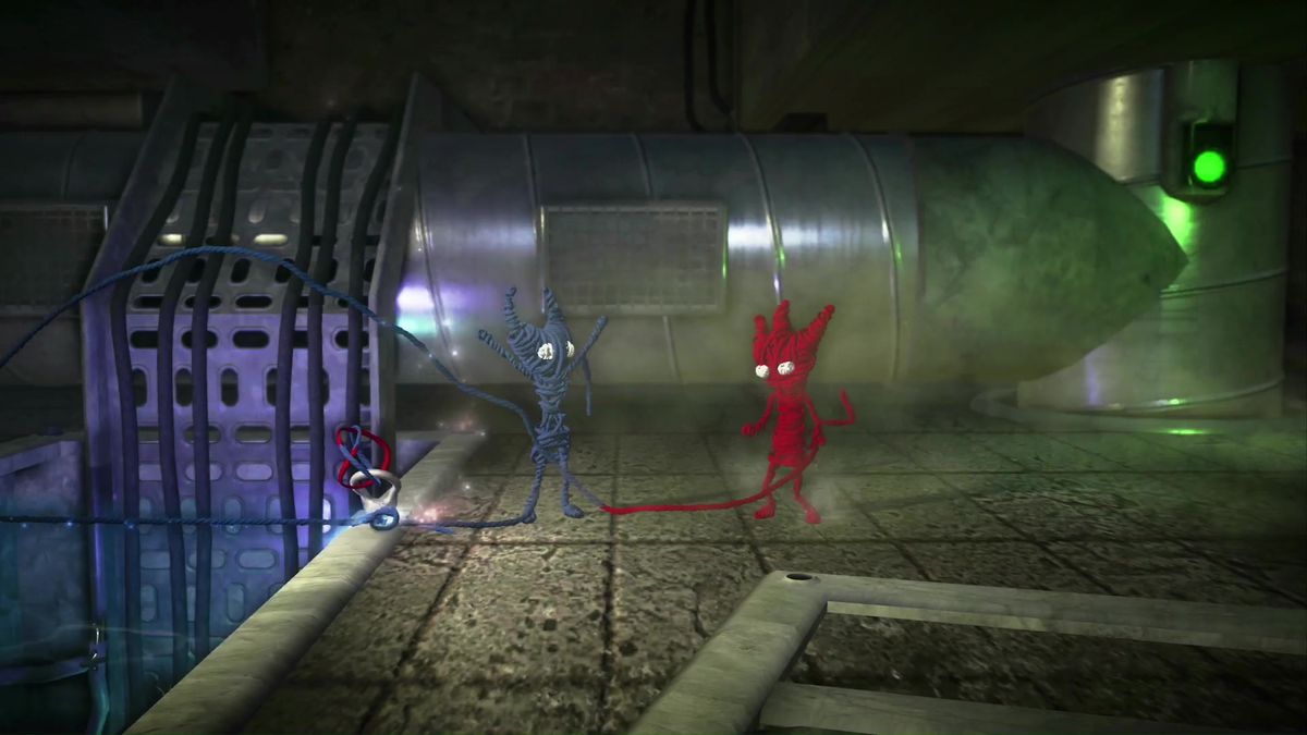 A blue Yarny stands to the left with its arms up in the air. A red Yarny stands to the right, looking at its companion.