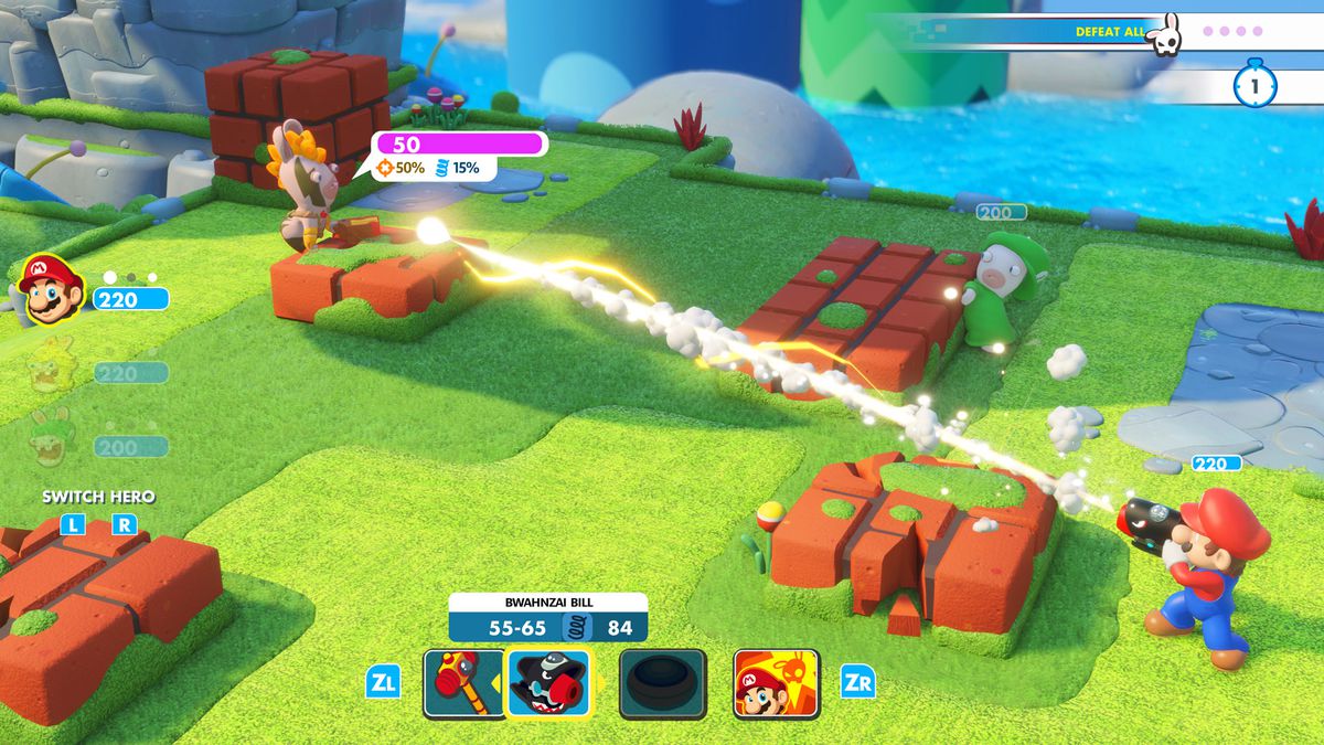 In this screenshot from Mario + Rabbids Kingdom Battle, Mario is aiming an arm cannon gun and shooting at a nearby rabbid with face paint. Both Mario and the Rabbid are standing next to waist-high blocks that they’re using as cover. An objective in the up