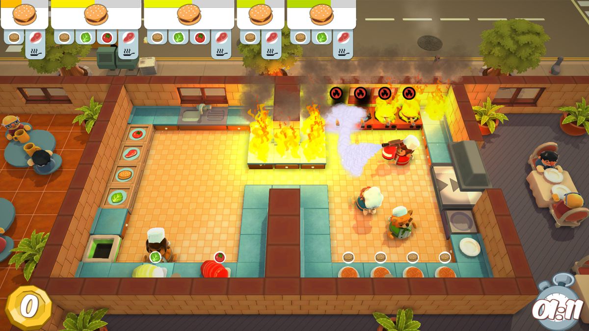 In Overcooked four characters are working together to make burgers. Meanwhile all of the cooktops are on fire.