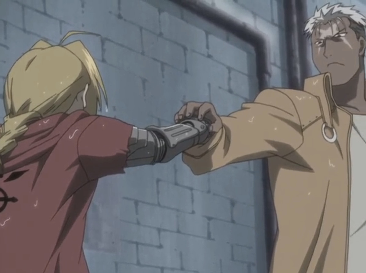 Scar holding Ed’s fist mid-punch and looking imposing in a still from Fullmetal Alchemist (2003)