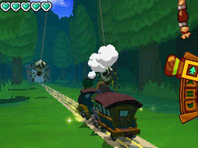 Tåget från Zelda: Spirit Tracks tuffar fram mot en spindel med hälsomätaren som visar fyra hjärtan