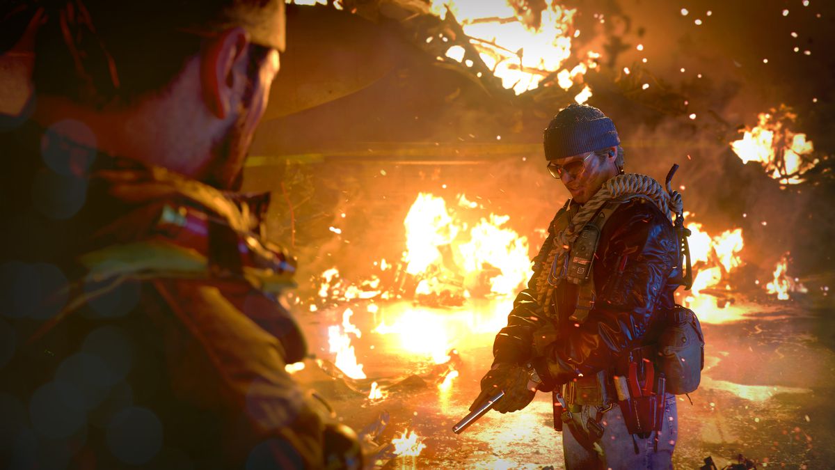 A player stands in front of burning wreckage in Call of Duty: Black Ops Cold War