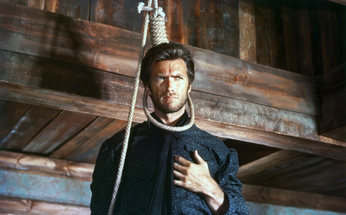 A young Clint Eastwood stands with a noose loosely around his neck and stares offscreen in The Good, the Bad and the Ugly 