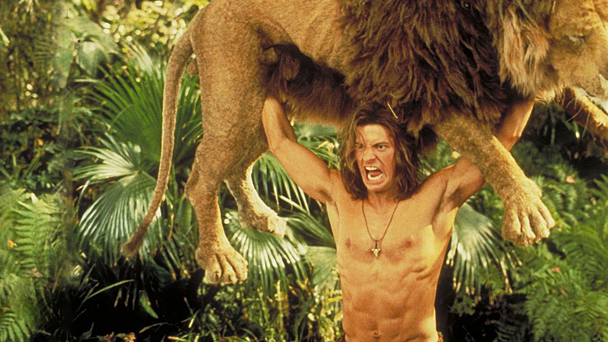 George of the Jungle lyfter ett lejon över huvudet.