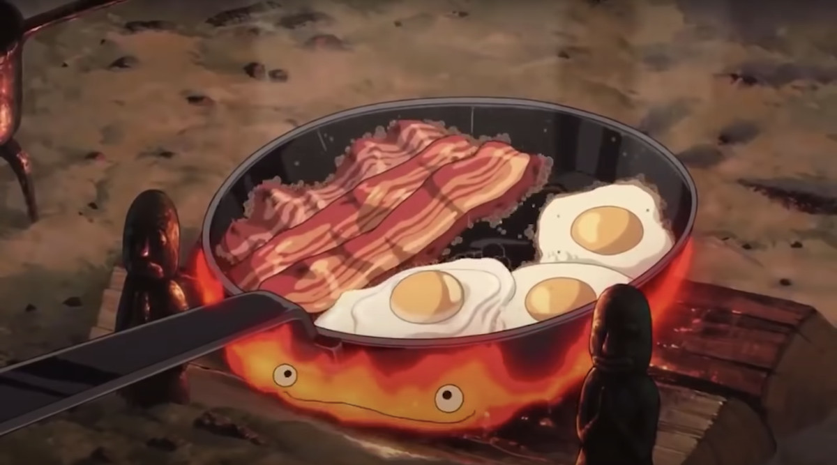 En välsmakande frukost lagar mat på kaminen i den här bilden från Howls Moving Castle.