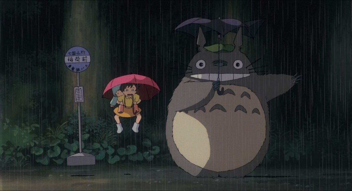 satsuki och mei hoppa i luften när totoro får regnet att krascha ner