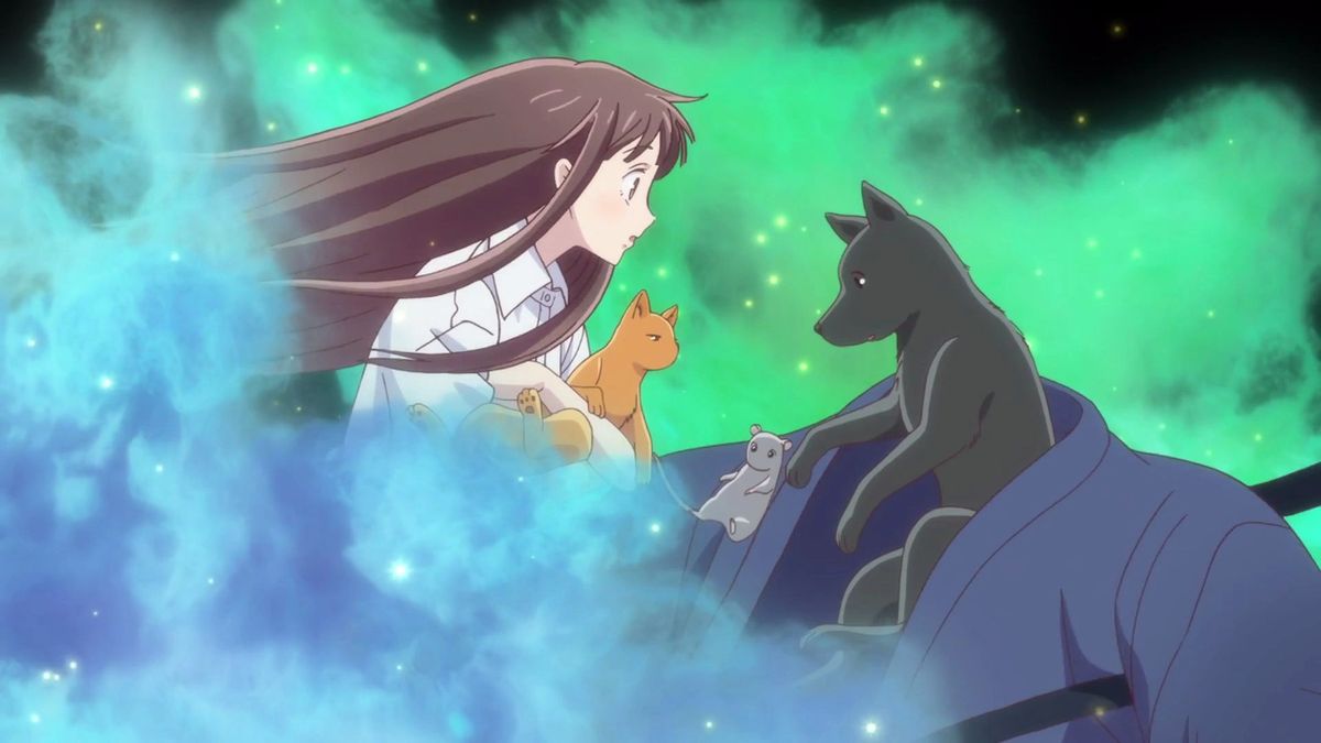 tohru håller en katt och en råtta och ser shigure förvandlas till en hund