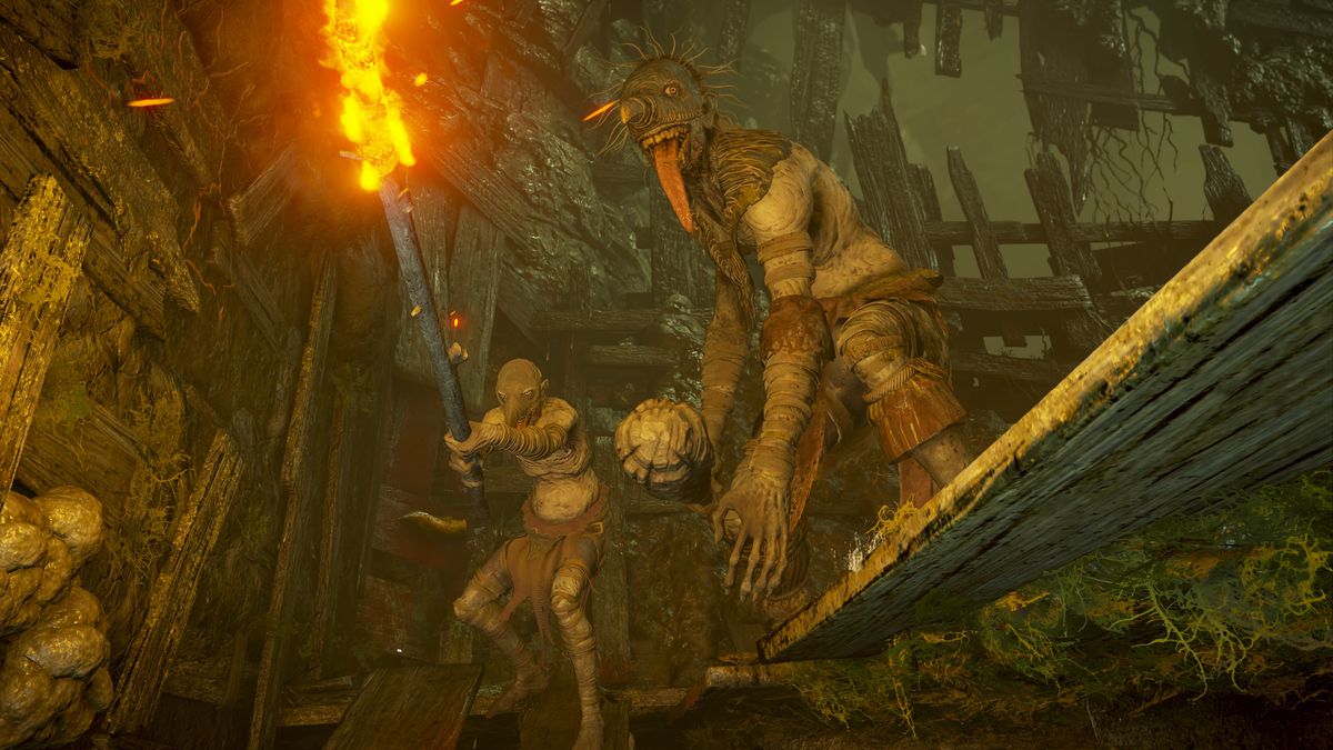 Två fördärvade attackerar spelaren i en skärmdump från Demon's Souls
