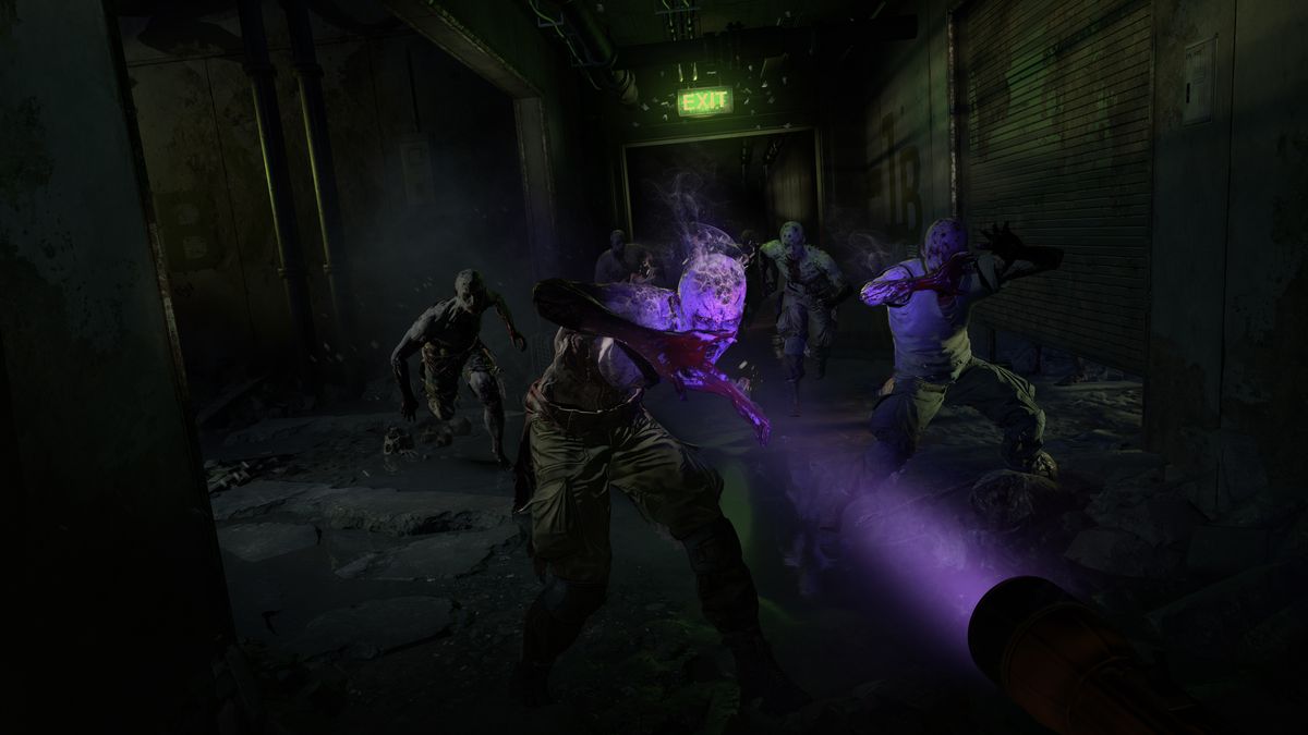 A player in first-person points a purple light at zombies in a screenshot from Dying Light 2