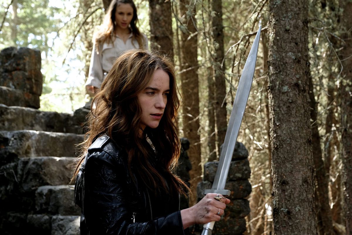 wynonna earp holding a silver sword in a forest
