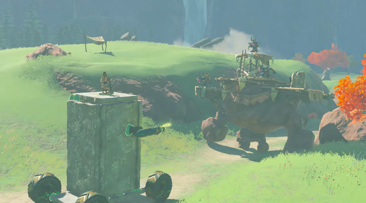 Länk på toppen av ett stenblock med hjul, slåss mot Bokoblins på en Talus i The Legend of Zelda: Tears of the Kingdom