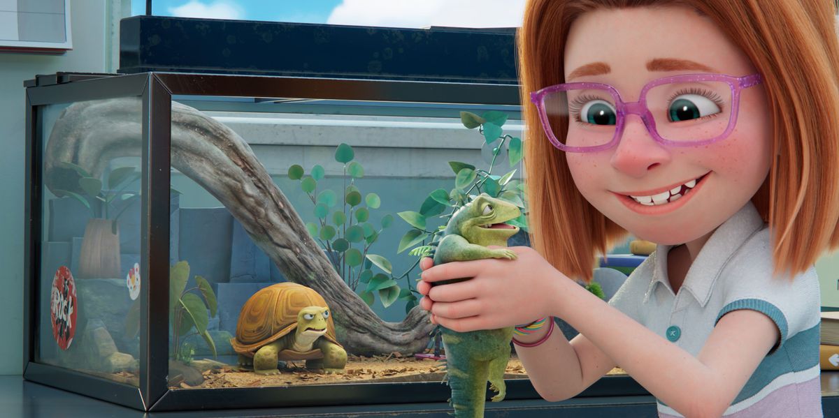 A smiling red-haired girl with pink glasses holds up a smiling iguana as a turtle in an aquarium behind them glares at them both in Netflix’s Leo