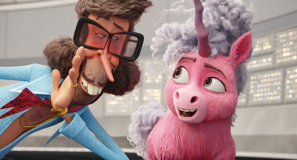 Thelma the Unicorn, a pink-furred, short, chubby unicorn with a wildly curly and tangled grey mane, looks delighted as a snaggle-toothed man wearing gold rings, tinted glasses, and a blue suit leans in to whisper to her in Netflix’s animated movie Thelma the Unicorn