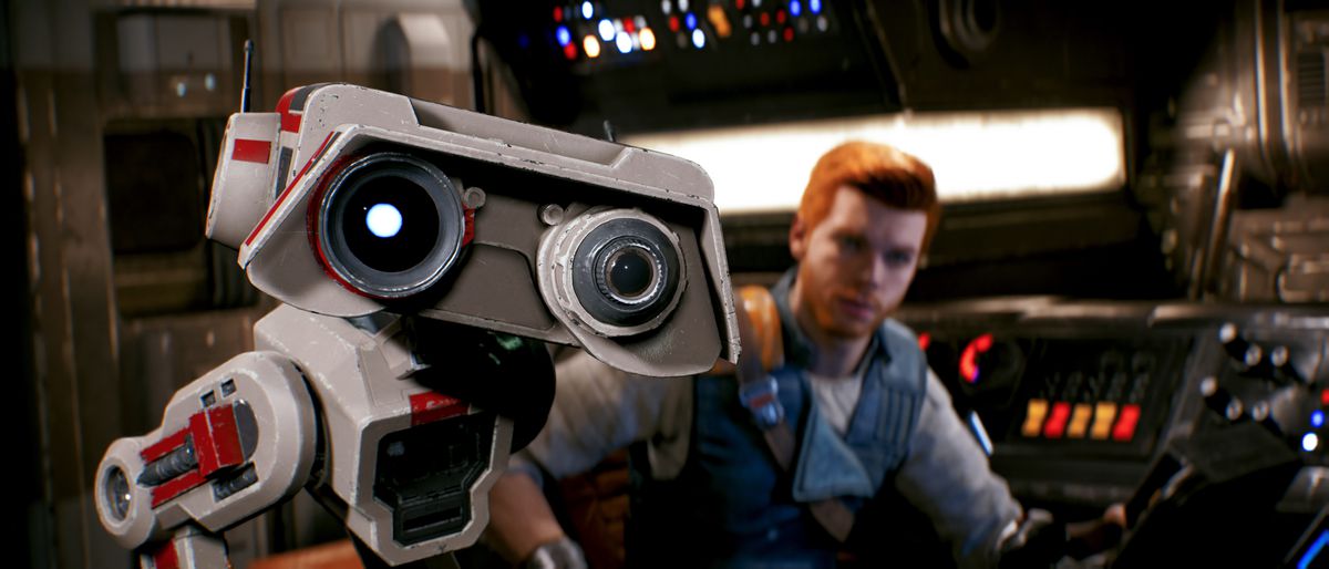 droiden BD-1 tittar mot kameran, med Cal Kestis bakom sig som sitter vid kontrollerna på ett rymdskepp, i Star Wars Jedi: Survivor