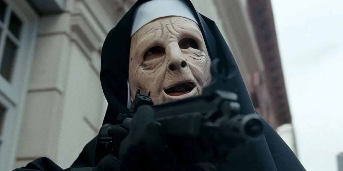 An armed robber in a ghoulish latex nun mask.