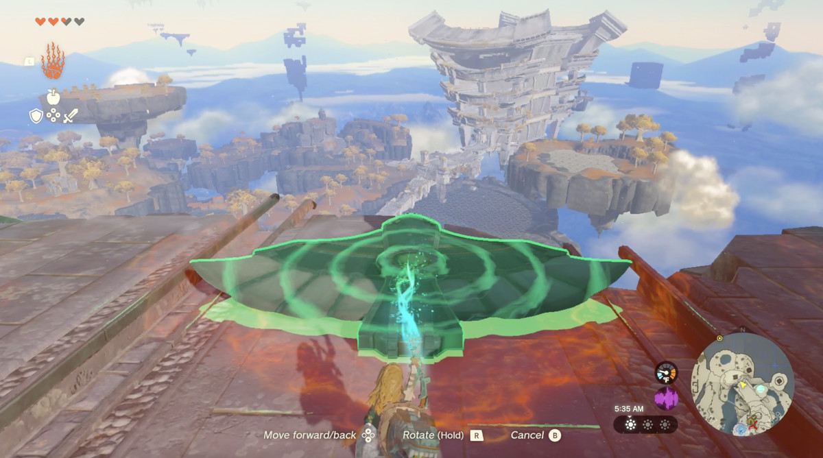 Link använder Ultrahand för att föra tillbaka en vinge till en avsats vid Temple of Time på Great Sky Island i Zelda Tears of the Kingdom.