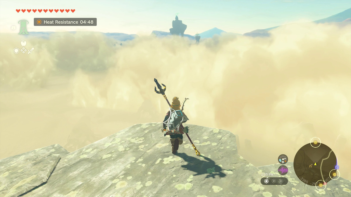 Link står på en hög klippa som övervakar sandstormen i Gerudo-öknen i Tears of the Kingdom