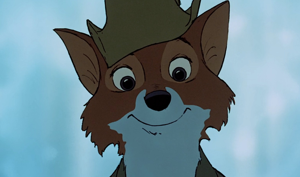 Disneys Robin Hood, en antropomorf räv i grönt, ler direkt in i kameran under låten 