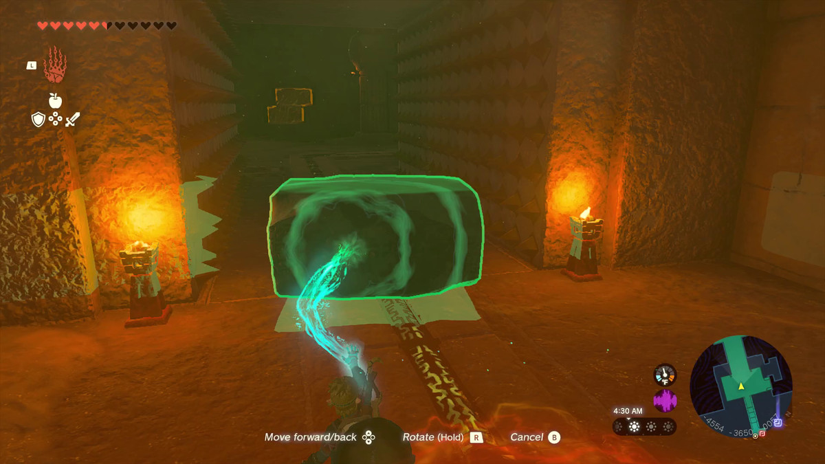 The Legend of Zelda: Tears of the Kingdom Link using Ultrahand to jam a mechanism in the Lightning Temple